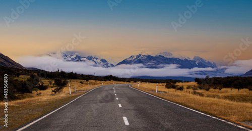 Panoramic view of Banner of traveling on the road with mountain range near Aoraki Mount Cook and the road leading to Mount Cook Village in New zealand 