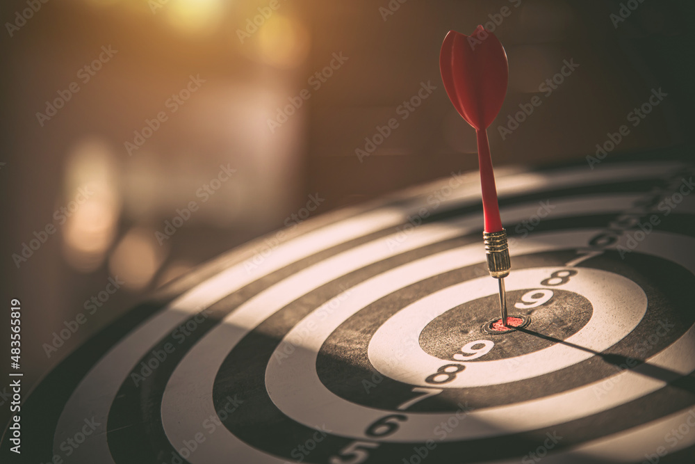 Bullseye target goal or dartboard has dart arrow throw hitting center shooting for financial business targeting planning to winner concept. Bullseye target goal or dartboard has dart arrow throw hitting center shooting for financial business targeting planning to winner concept.
