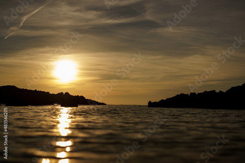 Cala Viola de Ponent, Menorca. September 2021. Magnificent sunset in the Mediterranean Sea. On one of the paradisaical beaches of the island of Menorca.