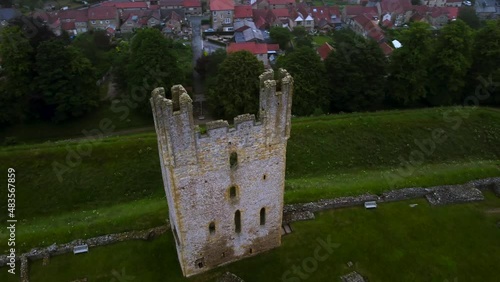 Drone helix of medieval Helmsley Castle, town and walled garden at dusk photo