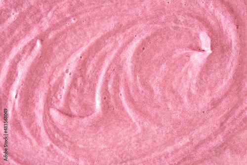 Pink cream texture. The surface of berry yogurt and a smoothie of whipped cream. Background texture of masks and scrubs for face and body. Pearlescent silver surface of pink foam. © Vera