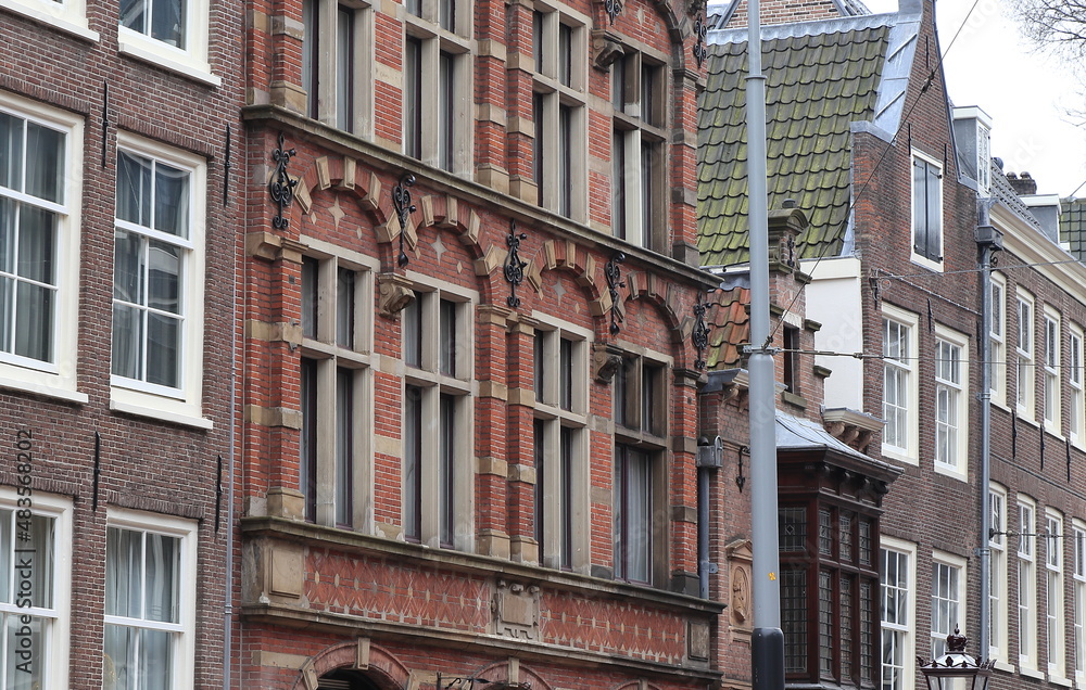 Fototapeta premium Amsteram Nieuwezijds Voorburgwal Street Brick House Facades Close Up, Netherlands