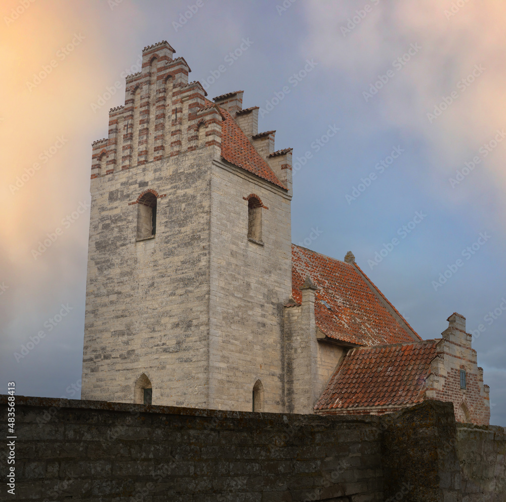Idyllic medieval church or chapel in warm bright evening light. Idyllic medieval church or chapel in warm bright evening light.