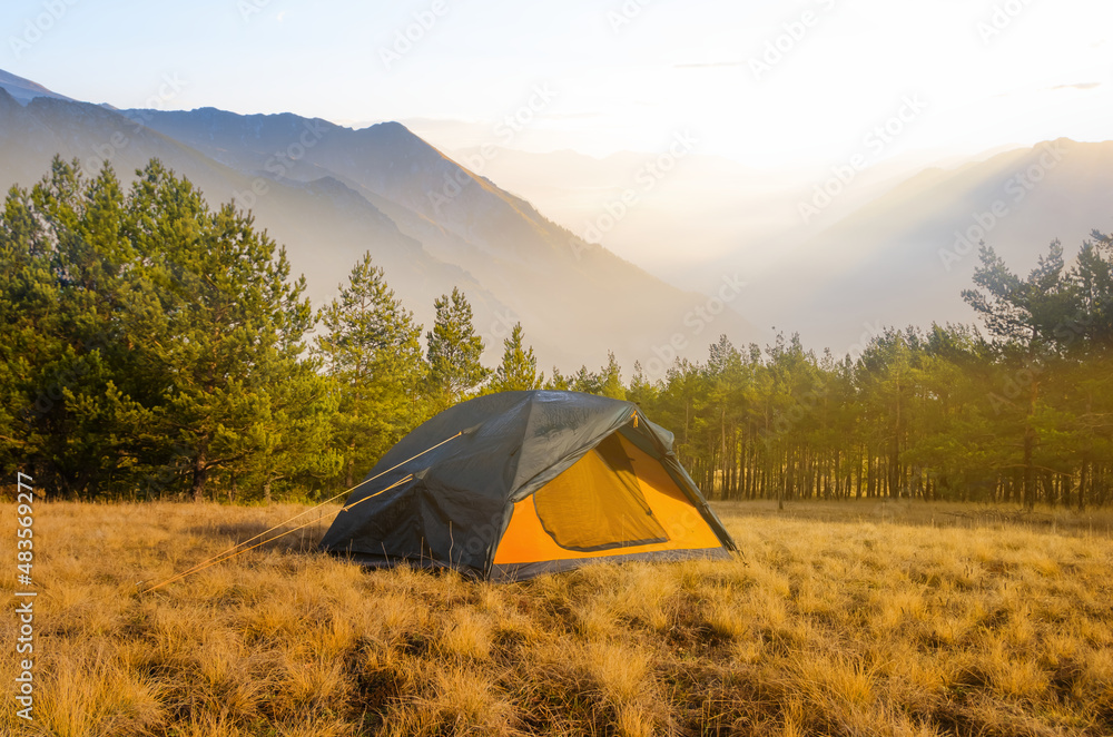 touristic tent stay in mountain valley at the early morning, touristic travel scene