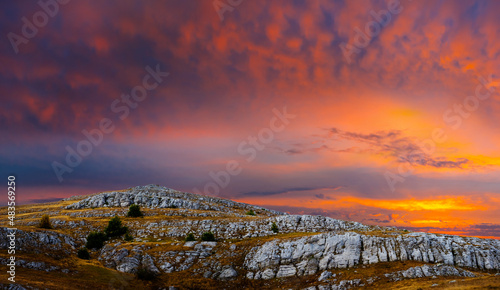 rocky mountain ridge at the dramatic sunset
