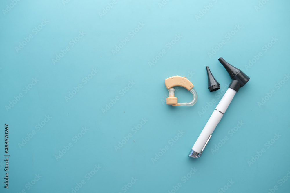 Hearing aid equipment on light green background Hearing aid equipment on light green background