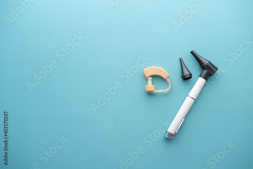 Hearing aid equipment on light green background  photo