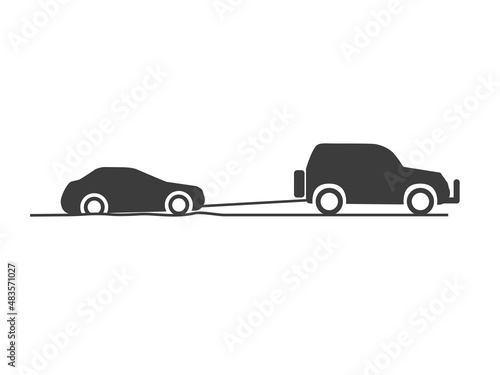 SUV pulls the car out of the pit. Towing