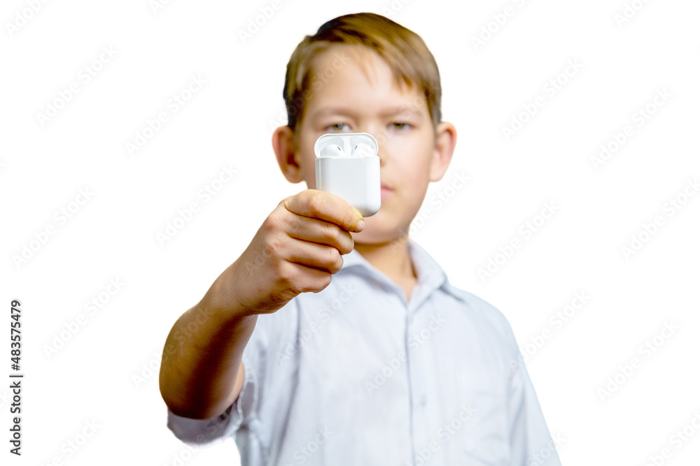 kid holds wireless bluetooth headphones in his hands kid holds wireless bluetooth headphones in his hands