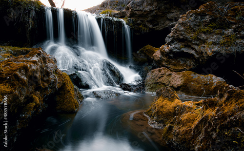 waterfall in the forest the backdrop of rocks