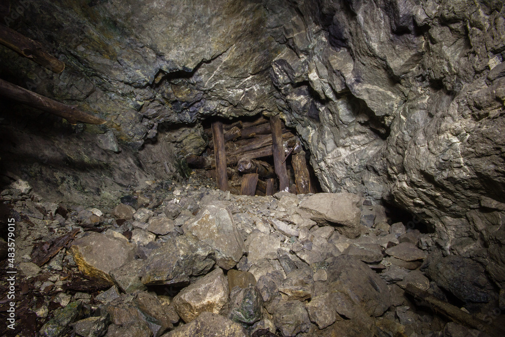 Underground gold mine tunnel with wooden timbering Underground gold mine tunnel with wooden timbering