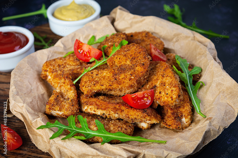 Fried chicken fillet with sauce and mustard. Crispy spicy fried chicken Fried chicken fillet with sauce and mustard. Crispy spicy fried chicken