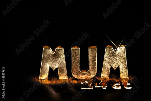 The word MUM. Worth her weight in 24ct gold. Mothers day card or birthday image with copy space  photo