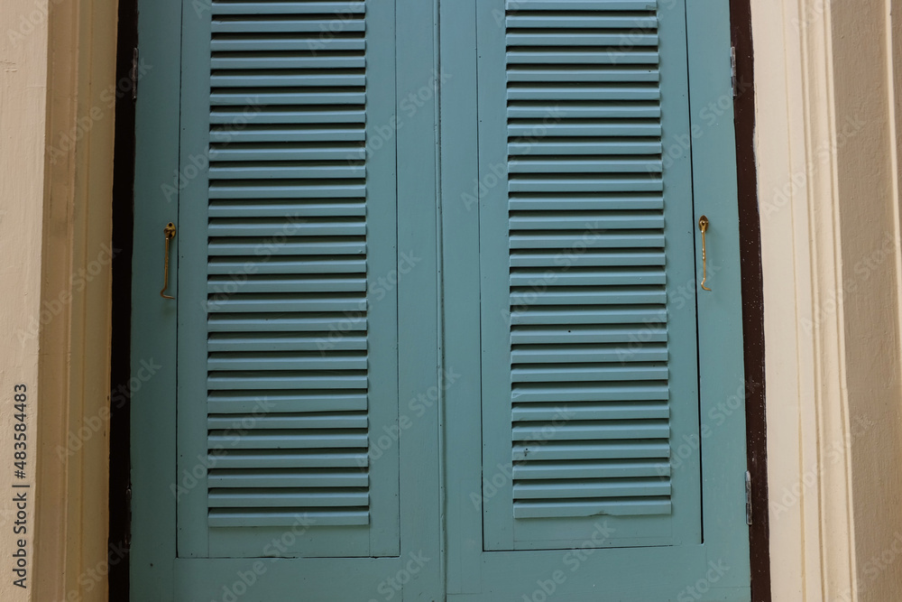 Fototapeta premium blue shutters on a window