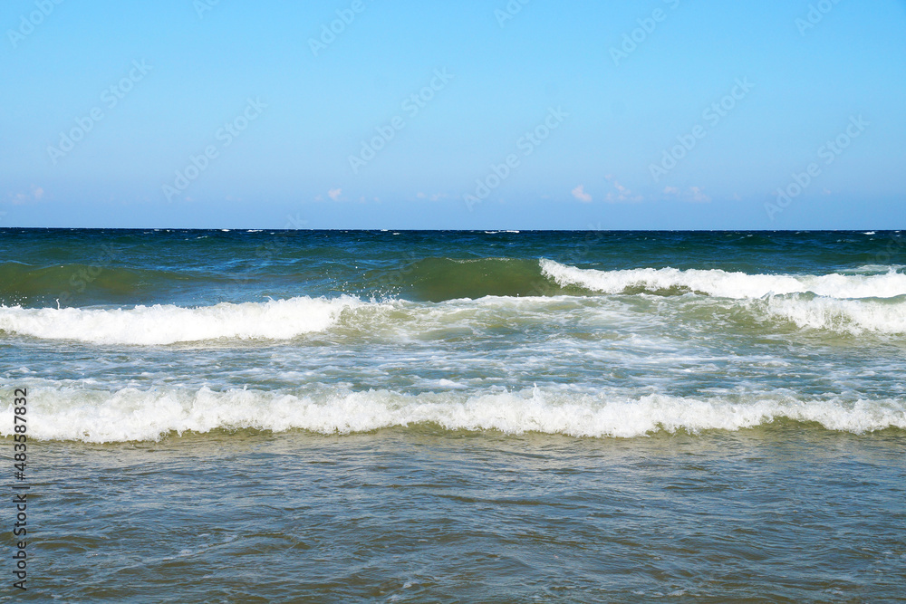 white waves, sea horizon in sunlight, seascape