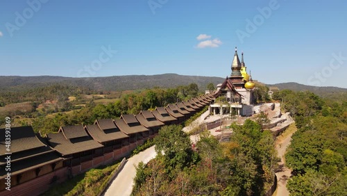 Wallpaper Mural Aerial footage towards the famous Wat Somdet in Phu Ruea revealing a beautiful landscape and blue sky, Ming Mueang, Loei in Thailand. Torontodigital.ca
