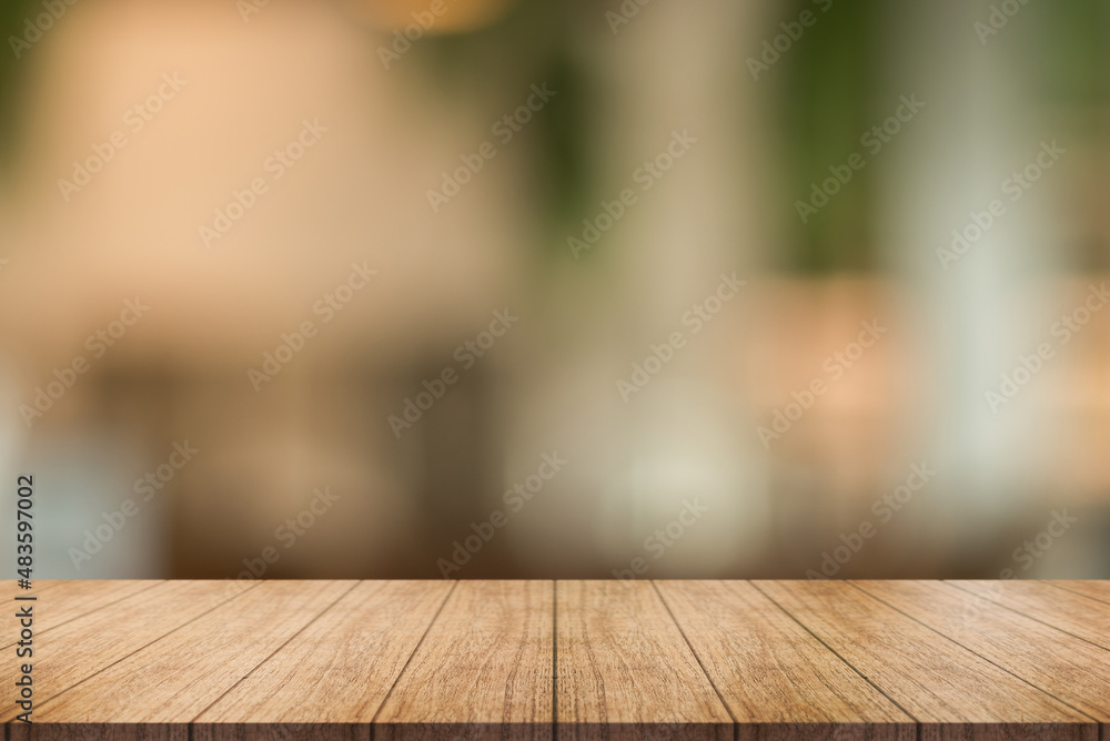 Empty wooden table top with lights bokeh on blur restaurant background. Empty wooden table top with lights bokeh on blur restaurant background.