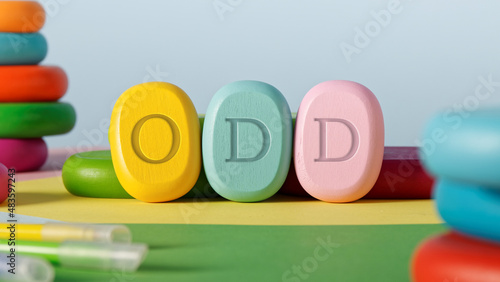 Letters ODD written on colorful toy blocks. Oppositional defiant disorder concept.
