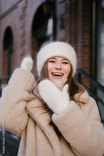 A young woman smiles brightly and laughs beautifully, emotions, happiness