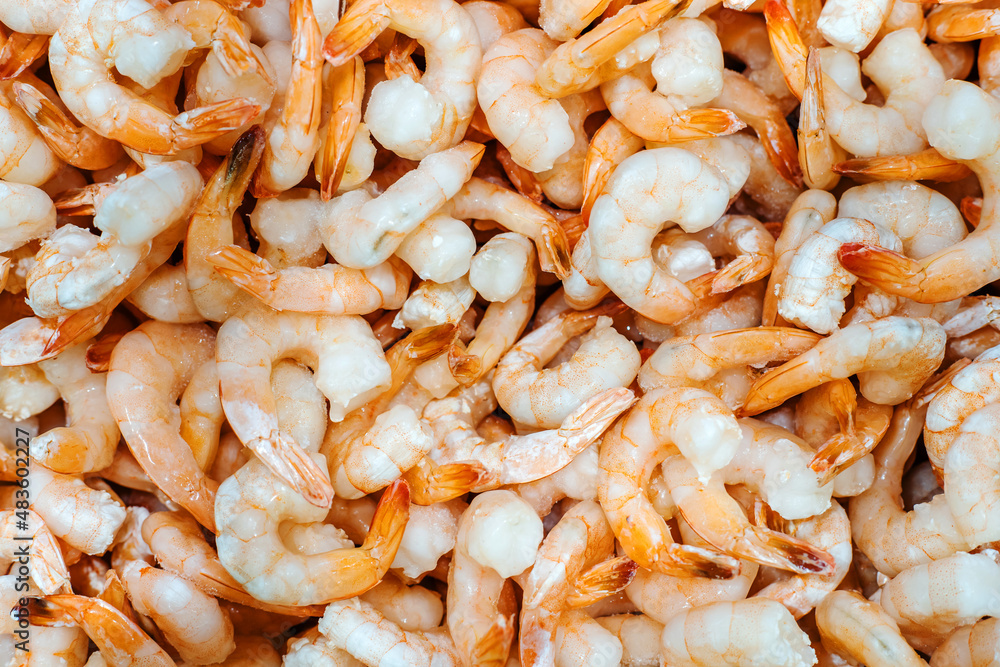 Frozen shrimp. Trade in high-quality seafood wholesale and retail. flat lay frame Frozen shrimp. Trade in high-quality seafood wholesale and retail. flat lay frame
