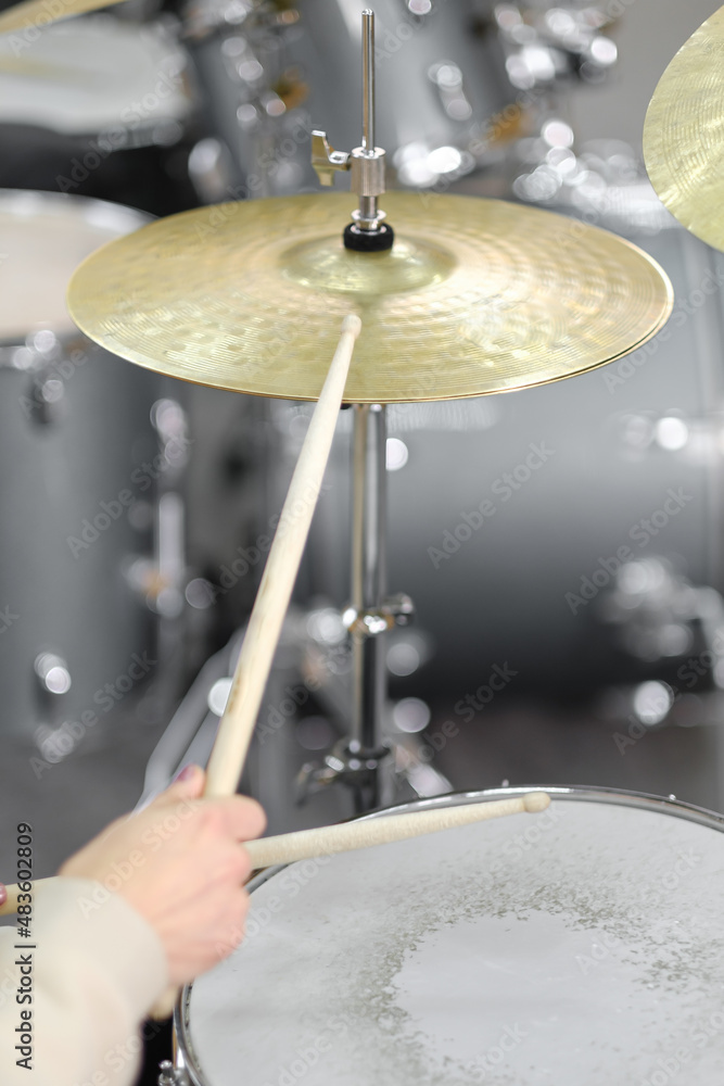 Obraz premium A close up of musician's hands. Drum kit playing.