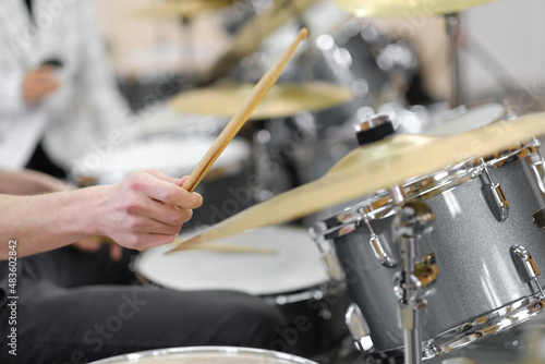 A close up of musician's hands. Drum kit playing.