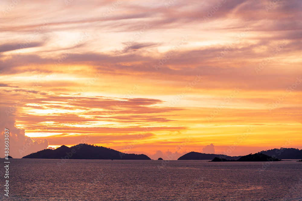 sunset or sunrise seascape on koh Lipe isaland with gold lighting sunset sky background sunset or sunrise seascape on koh Lipe isaland with gold lighting sunset sky background