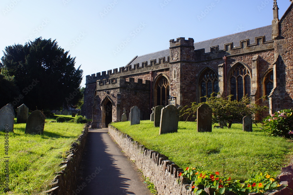 View of the graveyard of the Priory Church of St George in Dunster, Somerset (UK)
