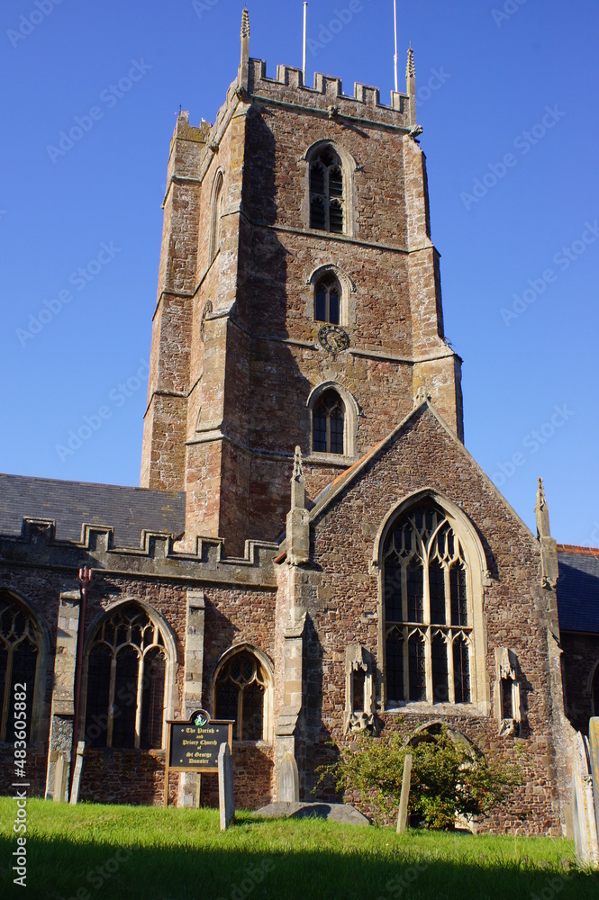 The bell tower of the Priory Church of St George in Dunster, Somerset (UK)