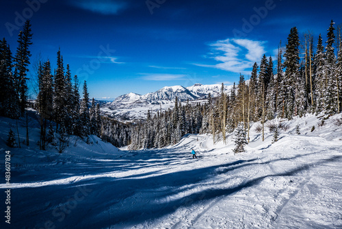 skier and shadows in mountain landscape