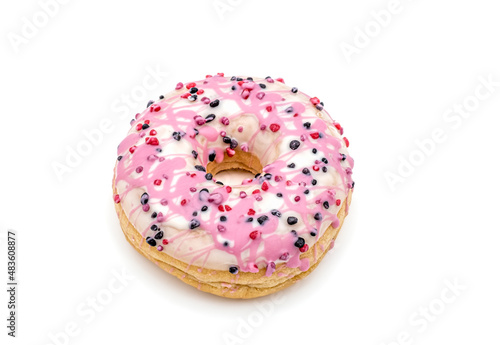 donut with white and pink chocolate icing and berries on white background