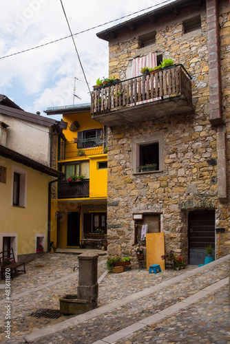 Historic buildings in the village of Dordolla in the Moggio Udinese of Udine province, Friuli-Venezia Giulia, north east Italy. A small corn field is in the foreground