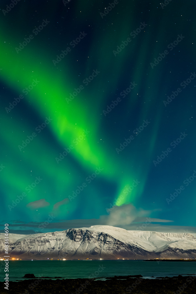 Aurora Borealis displaying over the snowcapped Mount Esja near Reykjavík, Iceland Aurora Borealis displaying over the snowcapped Mount Esja near Reykjavík, Iceland