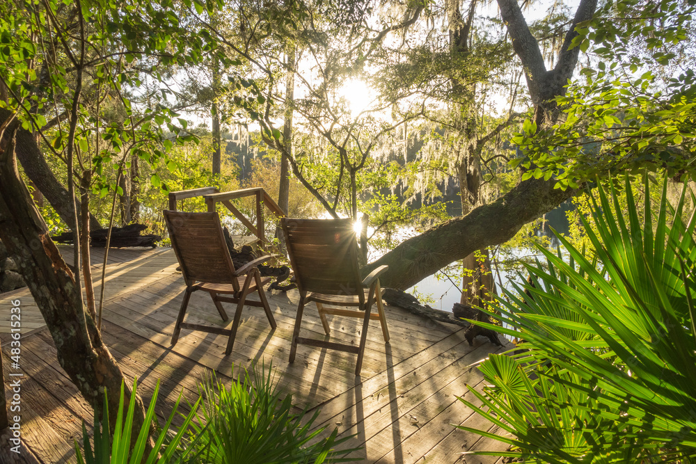 Deck chairs on scenic Suwannee river deck overlook. Gilchrist County Florida Deck chairs on scenic Suwannee river deck overlook. Gilchrist County Florida