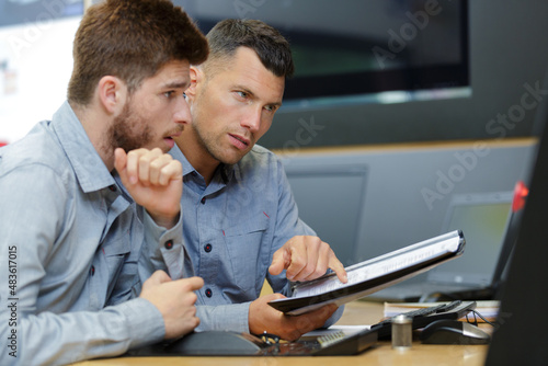 two male engineers working with new project