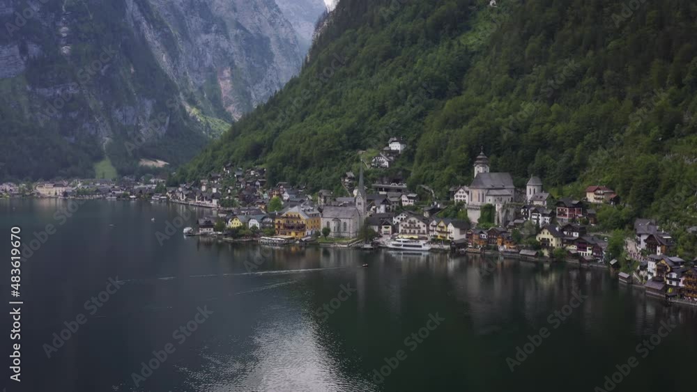 Old European city on the lake high in the Dolomites mountains aerial footage cinematic Old European city on the lake high in the Dolomites mountains aerial footage cinematic