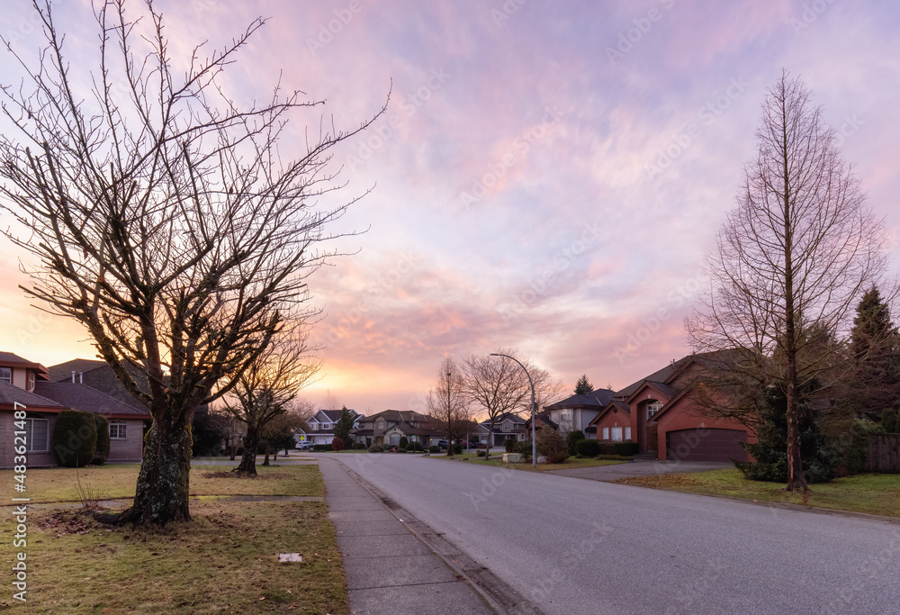Fraser Heights, Surrey, Greater Vancouver, BC, Canada. Beautiful Street view in the Residential Neighborhood during a colorful Winter Season. Dramatic Sunrise Sky.