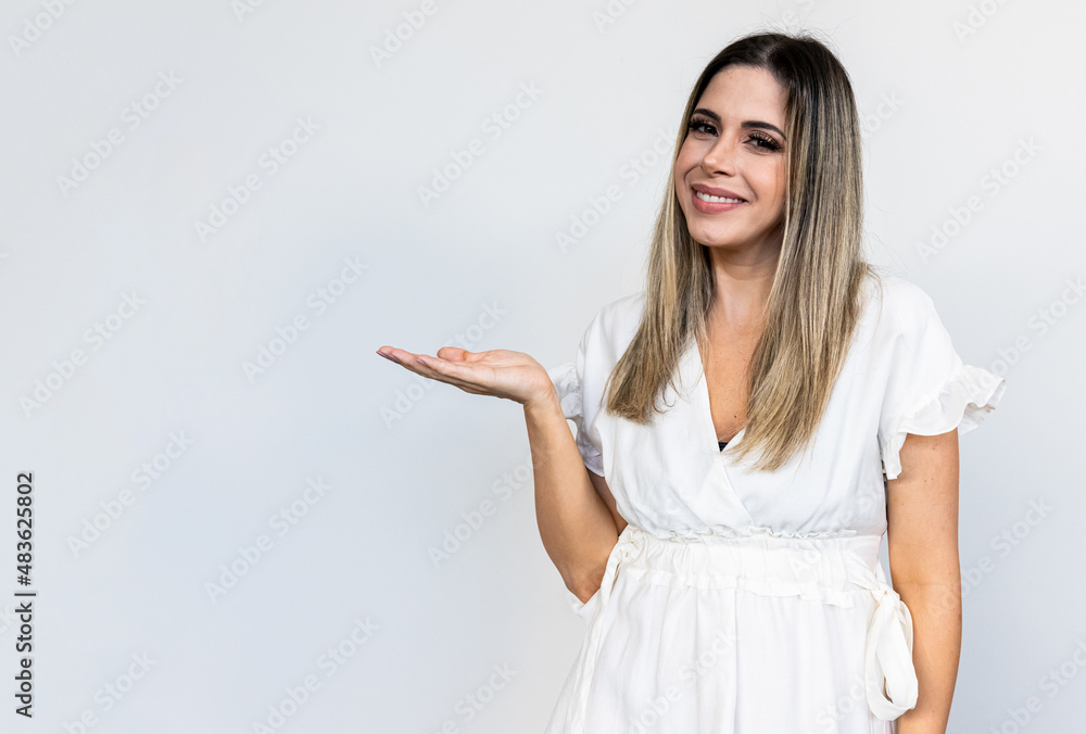 A young Latin girl points to the sides. Advertisement and presentation concept. A young Latin girl points to the sides. Advertisement and presentation concept.