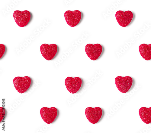 Seamless pattern of red marmalade hearts in sugar crystals. Valentine's Day concept.
