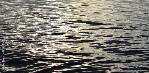 Small waves on the river. Texture of water.
