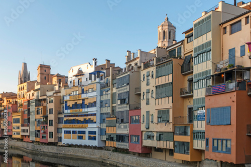 GIRONA, CATALONIA , SPAIN - JUNE 15, 2019: historical jewish quarter in Girona with Eiffel Bridge at sunrise, Barcelona, Spain, Catalonia