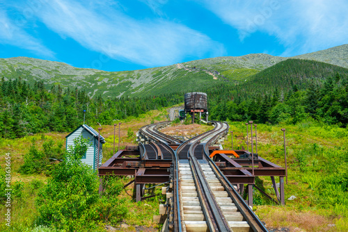 Mount Washington in summer with antique cog train track. Viewed from cog train on Mount Washington in White Mountain, New Hampshire NH, USA. photo