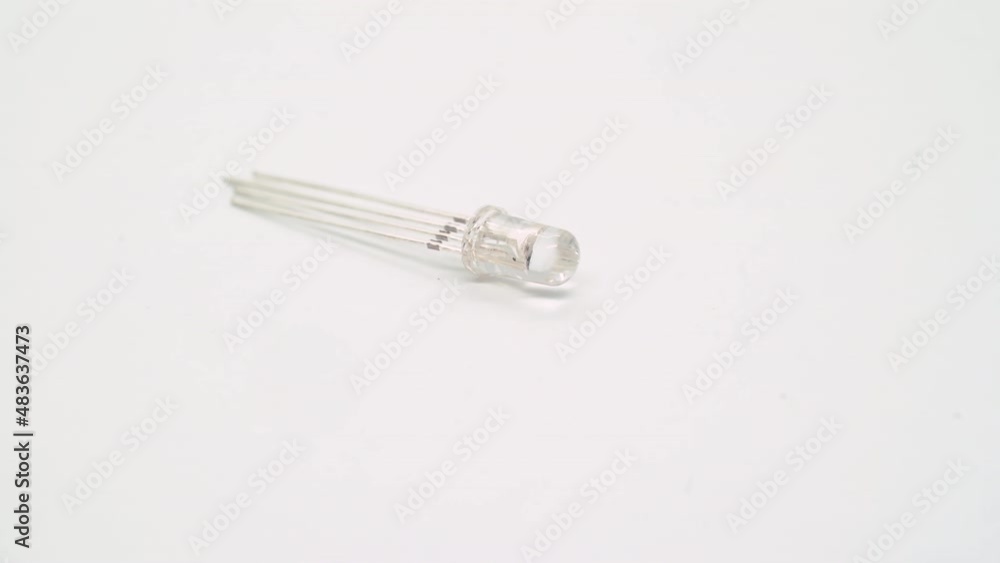 White RGB LED electronic component rotates on white background isolated. White RGB LED electronic component rotates on white background isolated.
