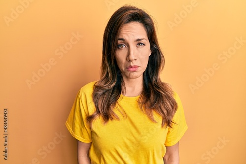 Young latin woman wearing casual clothes depressed and worry for distress, crying angry and afraid. sad expression. © Krakenimages.com