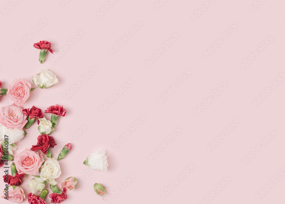 Various spring flowers spilled on a pastel pink background. Natural springtime conceptual template. Various spring flowers spilled on a pastel pink background. Natural springtime conceptual template.