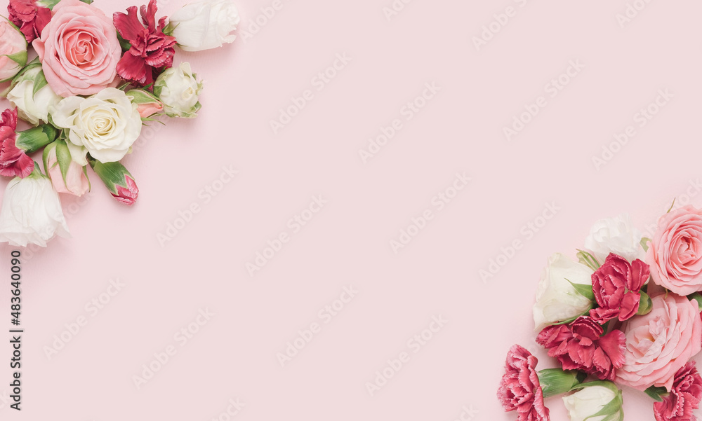 Dianthus and roses arranged in the corners of a pastel pink background. Romantic, feminine template.