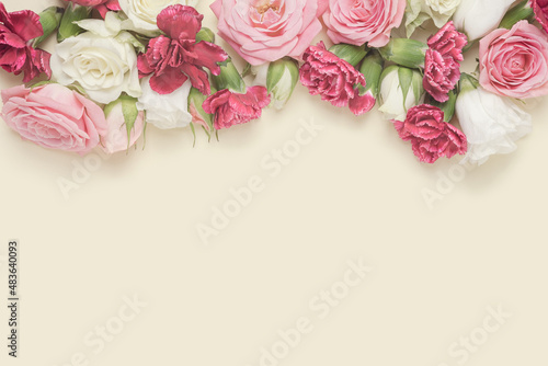 Spring flowers arranged against the pastel yellow background. Valentine s day  wedding backdrop.