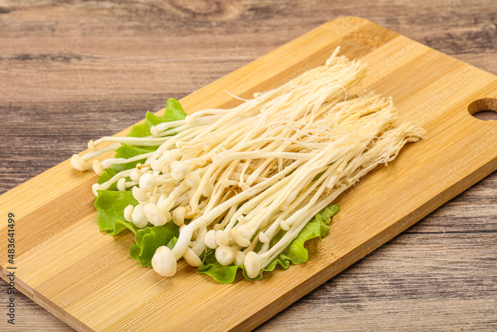 Raw Enoki mushrooms for cooking Raw Enoki mushrooms for cooking
