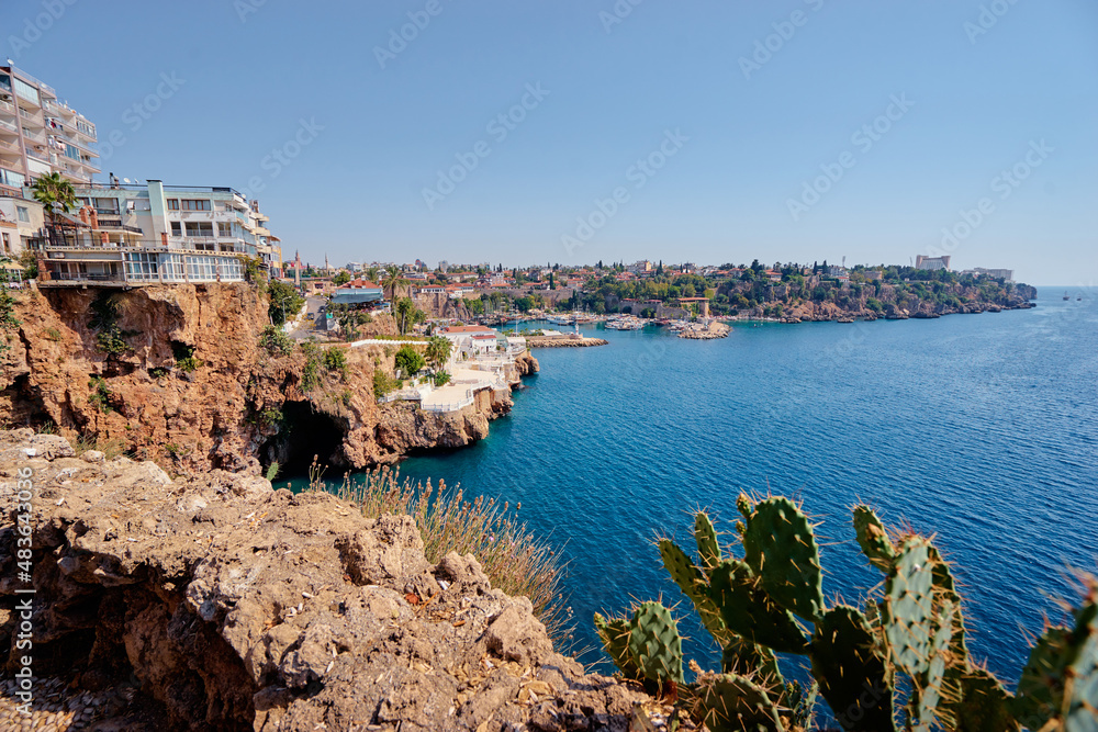 Landscape with sea marina and buildings on cliff. Antalya Turkey.