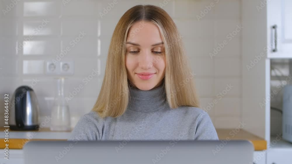 Adult student woman studying online on lockdown. Beautiful blonde female working on laptop computer at home. Freelancer person doing distant work on notebook pc in 4k stock video Adult student woman studying online on lockdown. Beautiful blonde female working on laptop computer at home. Freelancer person doing distant work on notebook pc in 4k stock video